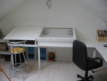 Jamie Lee Francis' studio drawing desks beneath a white pitched ceiling